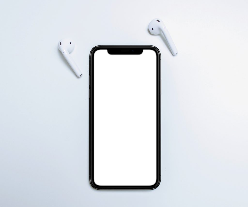 iphone XS and airpods with bright backround