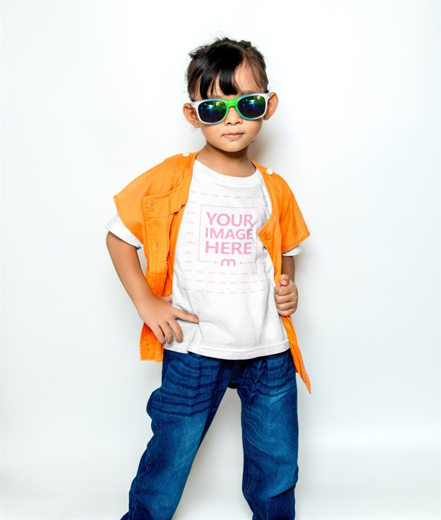 cool girl standing on white background. Hand on hip. he wears a white shirt and blue jeans. he is wearing sunglasses.